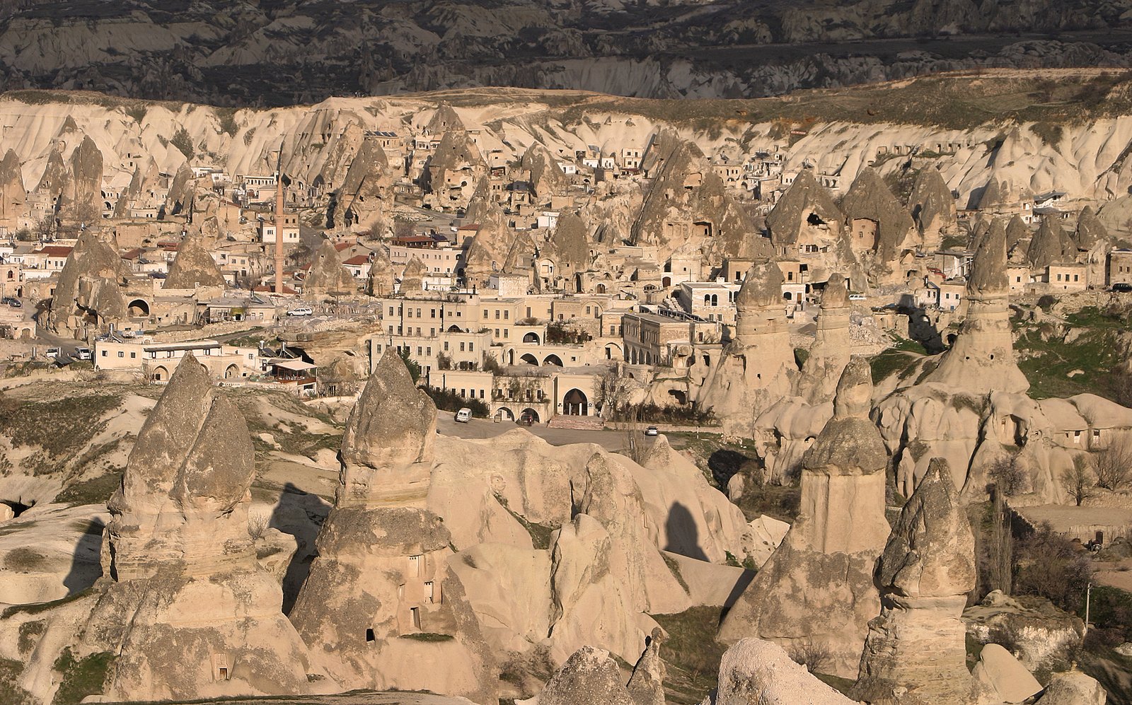 Göreme Valley in w:Cappadocia.Cappadocia, a region in central Turkey, is known for its Göreme National Park, which was added to the UNESCO World Heritage List in 1985.The first period of settlement within the region reaches to Roman period of Christian era. The area is also famous for its fairy chimneys rock formations, some of which reach 40 meters (130 feet) in height. Over thousands of years, wind and rain eroded layers of consolidated volcanic ash, or tuff, to form the sweeping landscape. From the 4th to 13th century AD, occupants of the area dug tunnels into the exposed rock face to build residences, stores, and churches which are home to irreplaceable Byzantine art. | Göreme National Park in Turkey