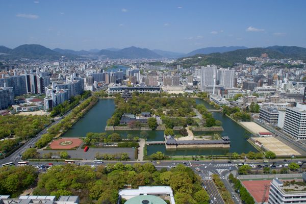 An overview of Hiroshima, Japan, and the Hiroshima Memorial Peace Park - commemorating the 1945 atomic bombing of the city - as seen from a hotel rooftop on April 11, 2016, as U.S. Secretary of State John Kerry visited the city to attend the G7 Ministerial Meetings. [State Department photo/ Public Domain] | Hiroshima in Japan